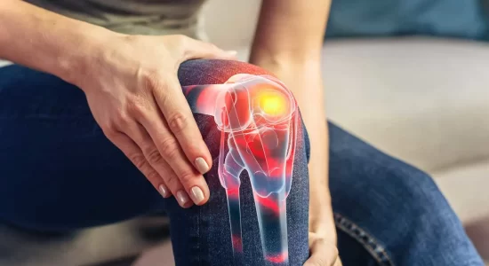 Illustration showing stem cell injection into a damaged knee joint with labeled cartilage, ligaments, and meniscus, highlighting the regenerative healing process used to repair knee damage and relieve chronic pain.