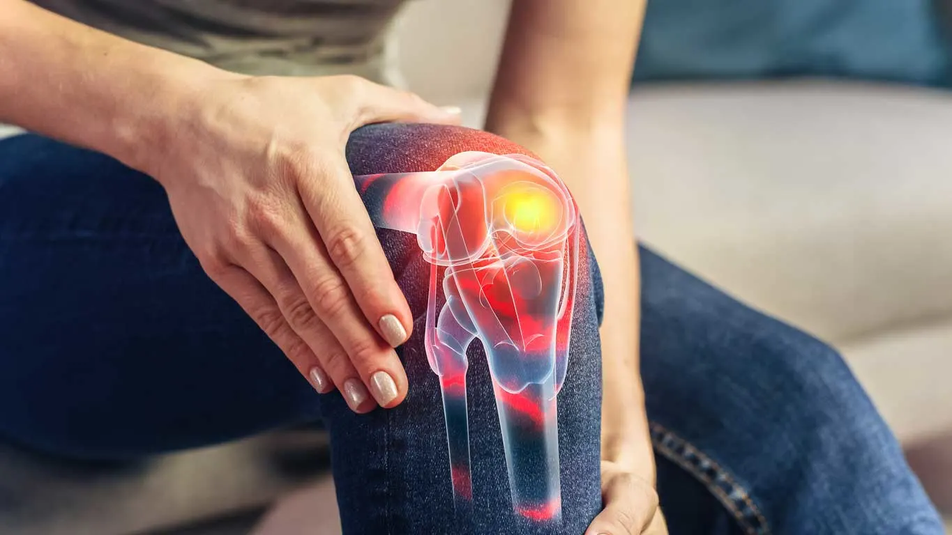 Illustration showing stem cell injection into a damaged knee joint with labeled cartilage, ligaments, and meniscus, highlighting the regenerative healing process used to repair knee damage and relieve chronic pain.