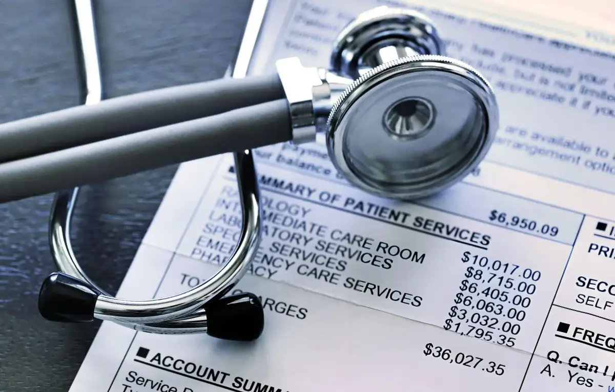 Stethoscope on medical bill, representing financial aspects and cost variability of stem cell therapy treatments