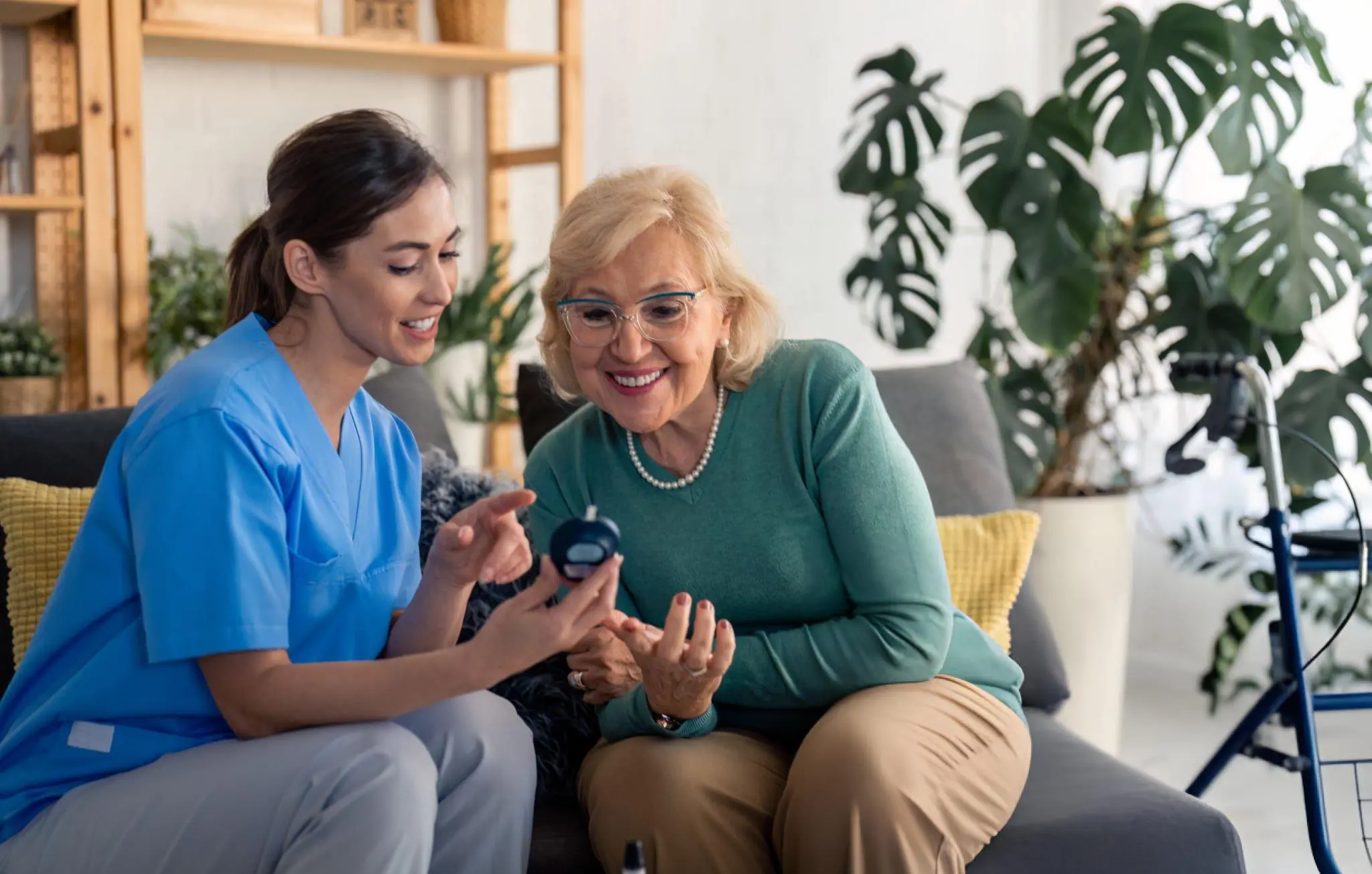 Healthcare professional discussing glucose monitoring with older adult—representing stem cell therapy support for type 1 and type 2 diabetes
